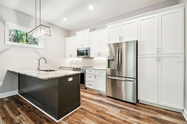 kitchen featuring appliances with stainless steel finishes, sink, and white cabinets