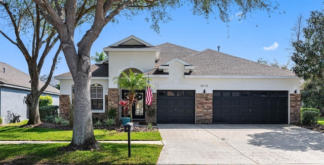 view of front of home with a garage and a front yard