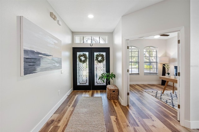 entryway with french doors and hardwood / wood-style floors