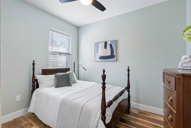 bedroom with ceiling fan and hardwood / wood-style floors