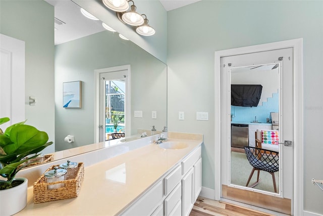 bathroom with vanity and hardwood / wood-style flooring