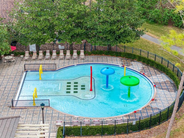 view of swimming pool with a patio