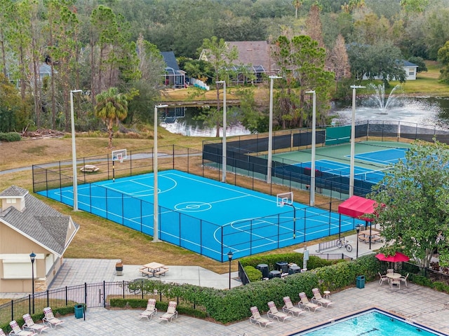 view of basketball court featuring a water view and tennis court