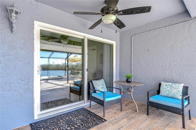 doorway to property with ceiling fan