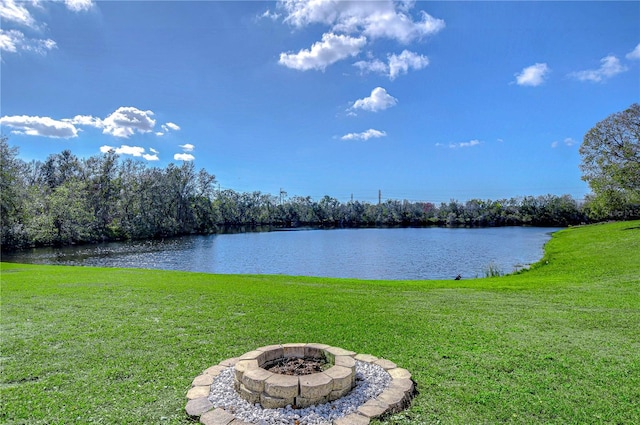 property view of water with a fire pit