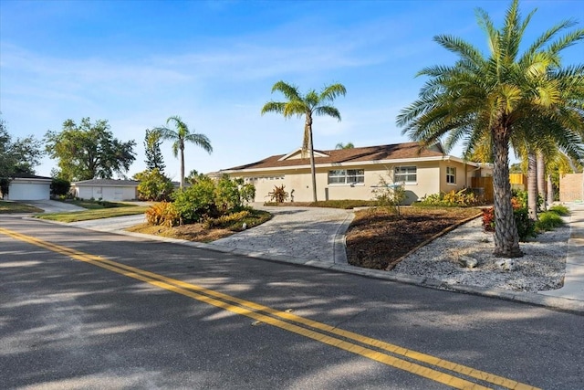 ranch-style home featuring a garage