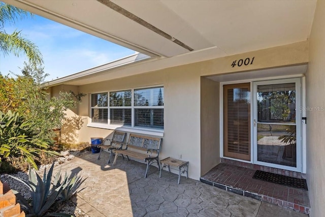 property entrance with a patio area