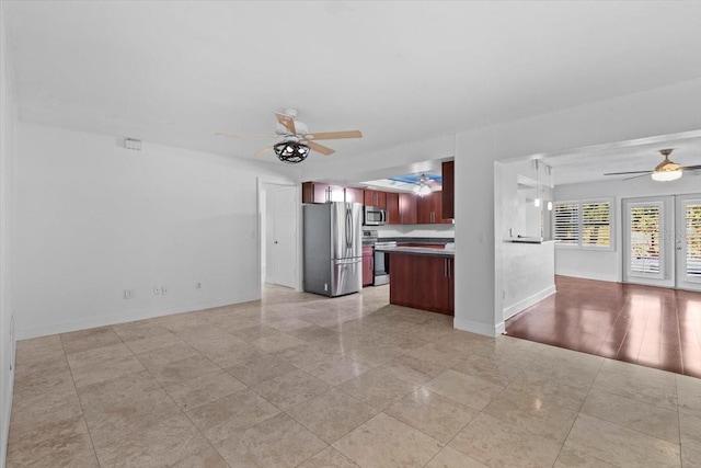 kitchen featuring ceiling fan and appliances with stainless steel finishes