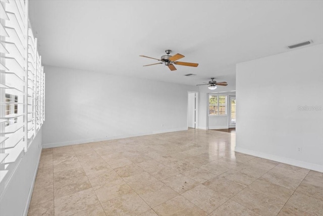 unfurnished room with ceiling fan