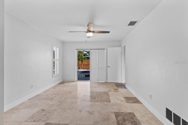 unfurnished room with ceiling fan