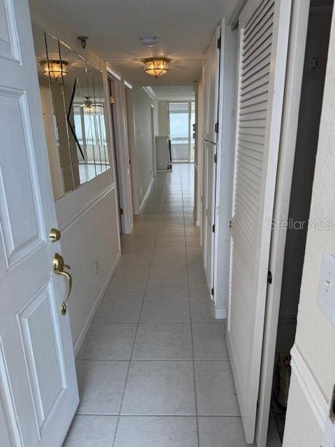 hallway with light tile patterned floors