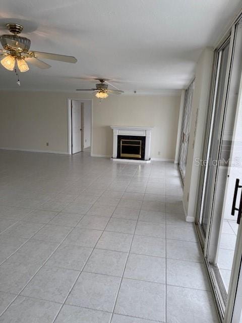 unfurnished living room featuring light tile patterned floors and ceiling fan