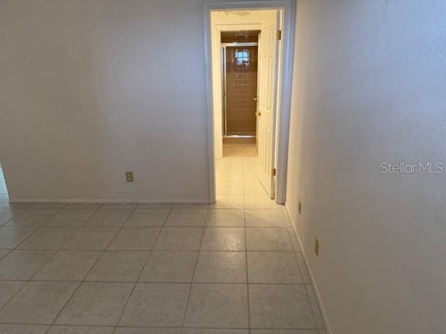 hallway featuring light tile patterned flooring