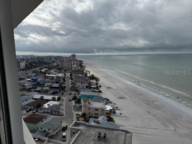 aerial view featuring a water view and a view of the beach