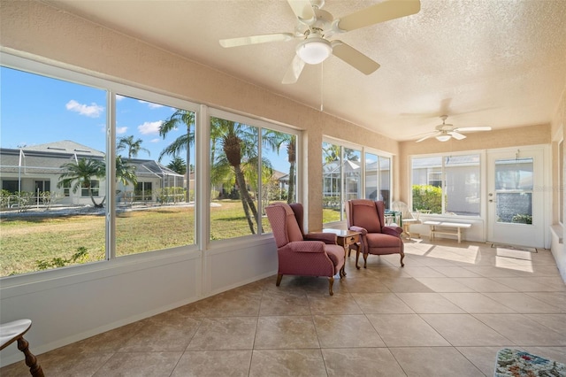 sunroom / solarium with ceiling fan