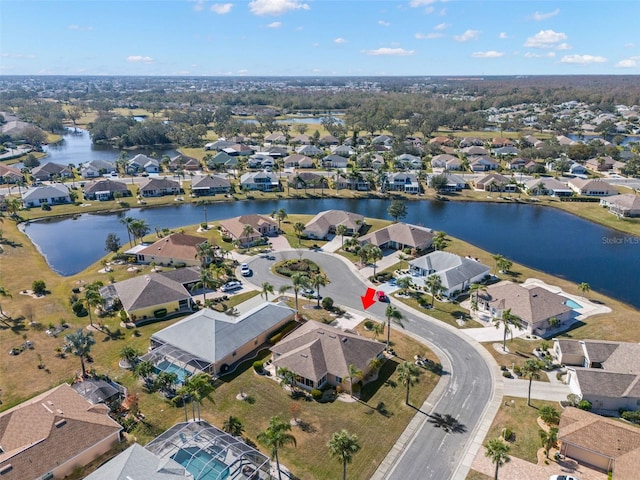 birds eye view of property featuring a water view