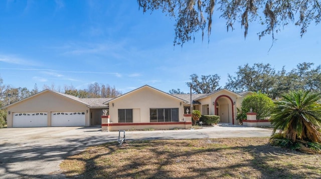 ranch-style home featuring a garage