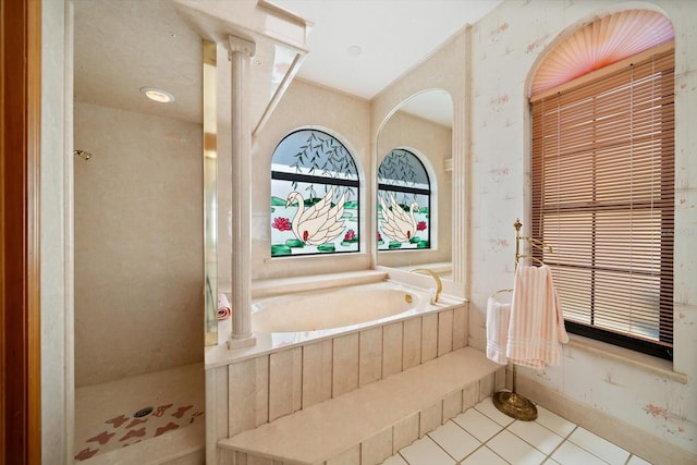 bathroom with tile patterned flooring and separate shower and tub