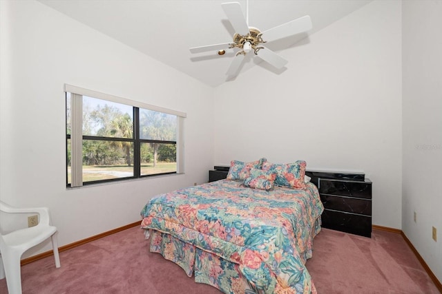 carpeted bedroom with ceiling fan and lofted ceiling