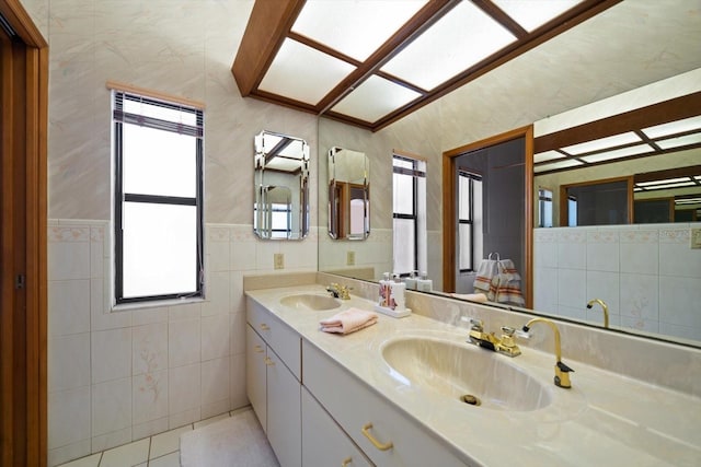 bathroom with vanity, tile walls, and tile patterned floors