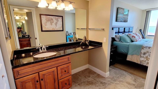 bathroom featuring vanity and an inviting chandelier