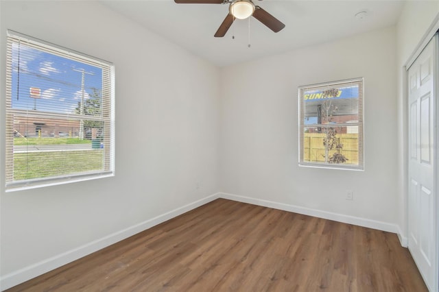 unfurnished room with ceiling fan and wood-type flooring