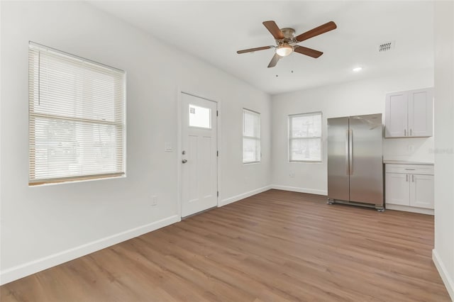 entrance foyer featuring ceiling fan and light hardwood / wood-style flooring