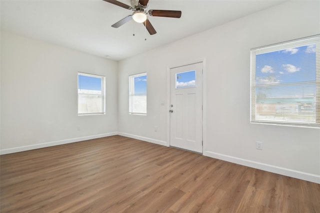 entryway featuring wood-type flooring and ceiling fan