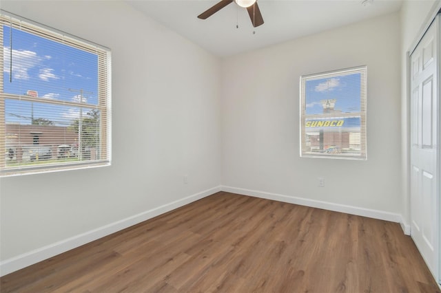 unfurnished room featuring hardwood / wood-style flooring and ceiling fan