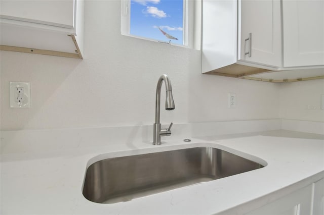 room details with sink and white cabinets