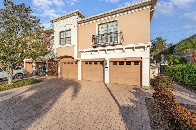 view of front of house with a balcony and a garage