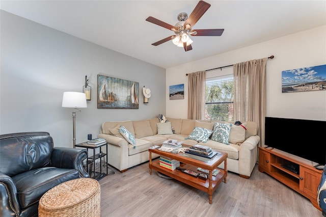 living room featuring ceiling fan and light wood-type flooring