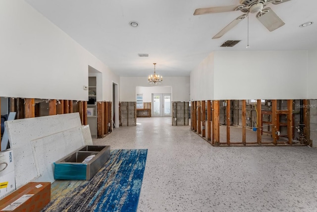 corridor featuring a notable chandelier and french doors