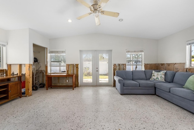 living room featuring french doors, ceiling fan, lofted ceiling, and plenty of natural light