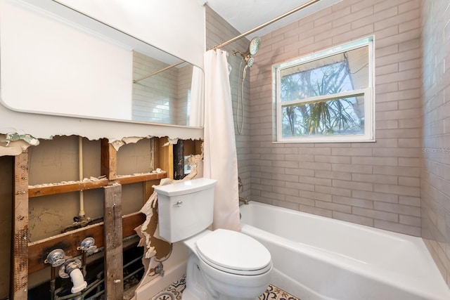 bathroom with shower / bath combo and toilet