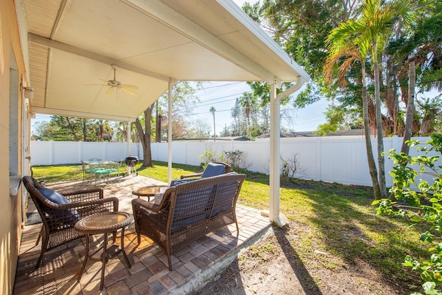 view of patio / terrace featuring ceiling fan