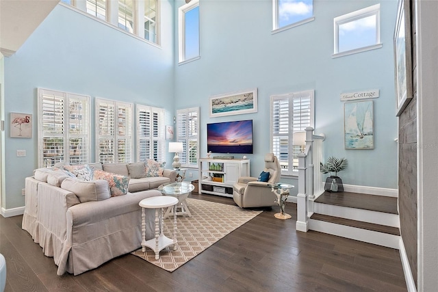 living room with dark hardwood / wood-style flooring