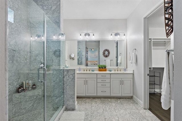 bathroom with vanity and an enclosed shower