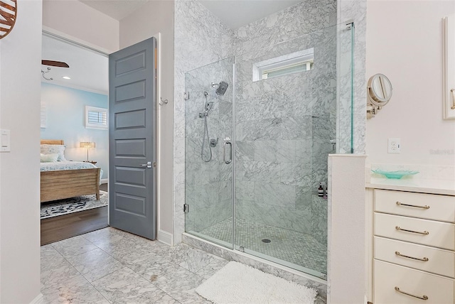 bathroom with a shower with door and vanity