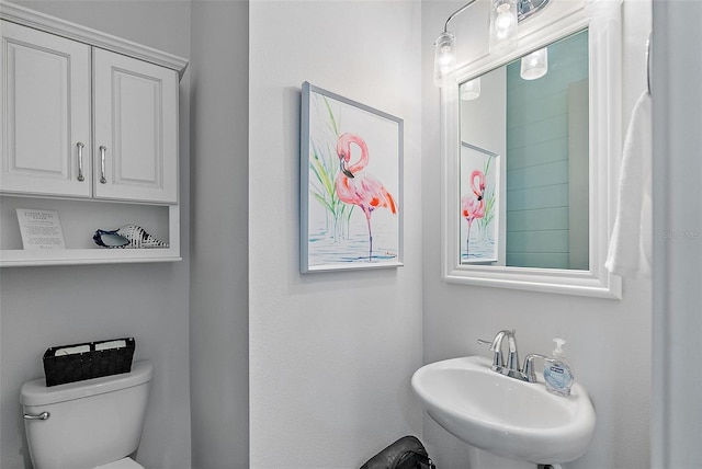 bathroom featuring sink and toilet