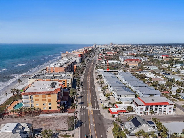 drone / aerial view with a water view and a view of the beach