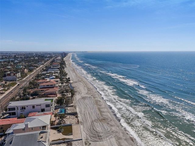 aerial view featuring a water view and a view of the beach