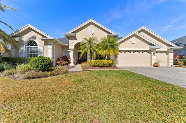 view of front of house featuring a garage and a front yard