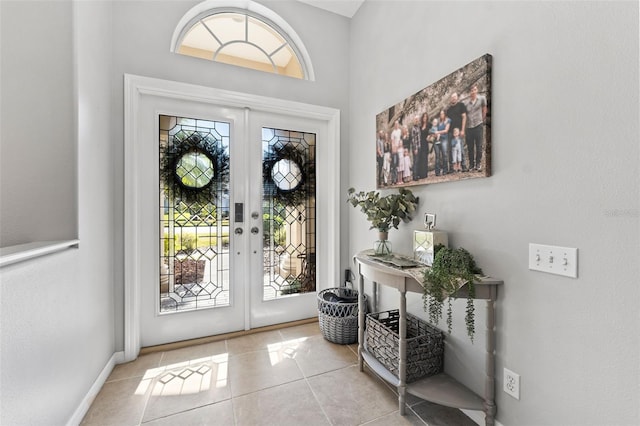 tiled entryway featuring french doors