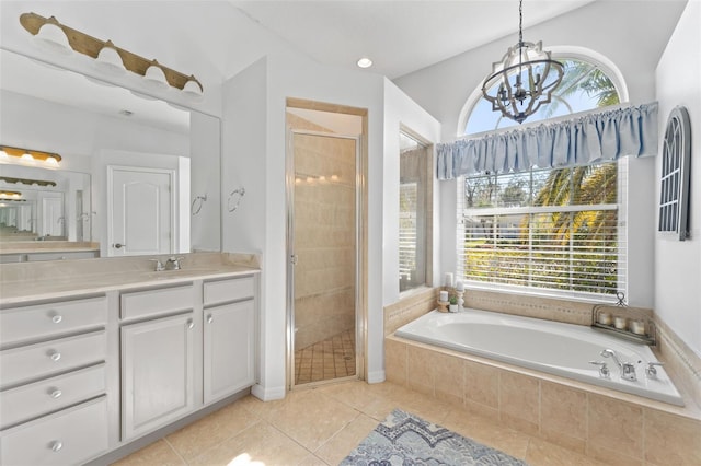 bathroom featuring independent shower and bath, vanity, tile patterned floors, and a chandelier