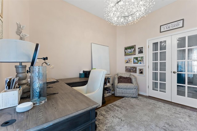 office featuring dark hardwood / wood-style flooring, an inviting chandelier, and french doors