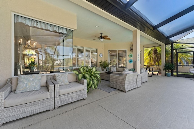 exterior space featuring a lanai, outdoor lounge area, and ceiling fan