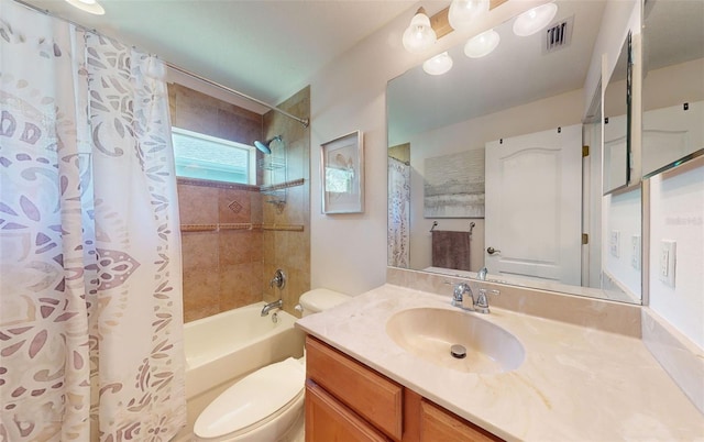 full bathroom with vanity, toilet, and shower / tub combo with curtain