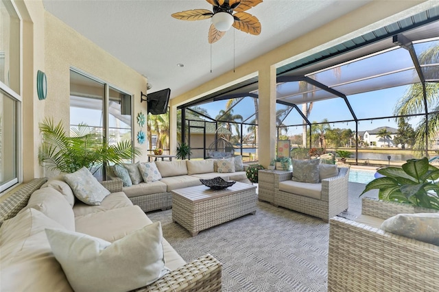 sunroom featuring ceiling fan