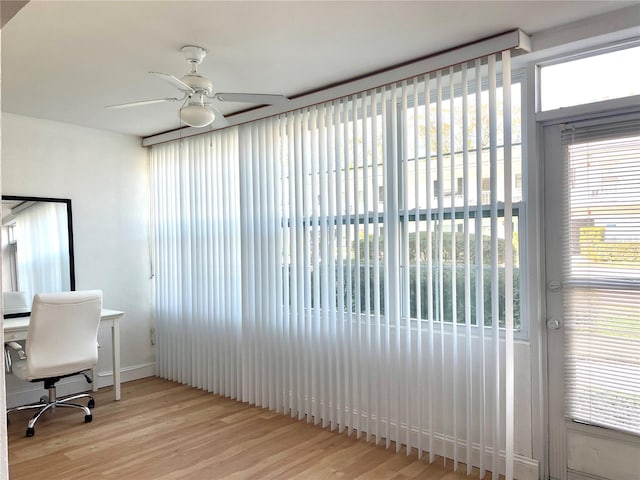 office area with ceiling fan and wood finished floors